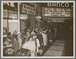 Crowd outside the Banco Theatre in Bedford-Stuyvesant, Brooklyn, for screening of Oscar Micheaux's film The Betrayal, ca. 1948