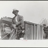Negro day laborer moving from one man's farm to another to get work. He wasn't needed any more by former "employer." The son of his new employer said his father used to have tenants but that they "skinned" him too often by moving out on him all the time