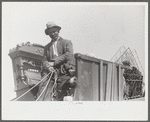 Negro day laborer moving from one man's farm to another to get work. He wasn't needed any more by former "employer." The son of his new employer said his father used to have tenants but that they "skinned" him too often by moving out on him all the time