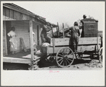 Negro day laborer moving from one man's farm to another to get work. He wasn't needed any more by former "employer." The son of his new employer said his father used to have tenants but that they "skinned" him too often by moving out on him all the time