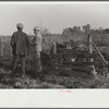 Melody Tillery (rural rehabilitation client) and one of supervisors diescussing some of his livestock: cows and pigs. Pike County, near Tray, Alabama