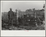 Melody Tillery (rural rehabilitation client) and one of supervisors diescussing some of his livestock: cows and pigs. Pike County, near Tray, Alabama