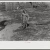 Ten year old child of George Cowley Family (rural rehabilitation client). Her bones break exceptionally easy (diet deficiency said to be one of causes) and one leg has been broken five times and doesn't mend properly. Pike County, Alabama