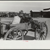 Outside the cooperative store on Saturday morning, Gees Bend, Alabama. Man in wagon is Earl Lee Young