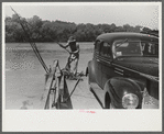 Steering the ferry for a landing at Gees Bend, Alabama