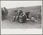 Vegetable pickers, migrants, waiting after work to be paid. Near Homestead, Florida