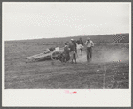 Vegetable pickers, migrants, waiting after work to be paid. Near Homestead, Florida