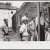 Spectators at auction sale of house and household goods, York County, Pennsylvania