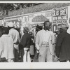 Some of the Negroes watching itinerant salesman selling goods from his truck in the center of town on Saturday afternoon, Belzoni, Mississippi Delta, Mississippi