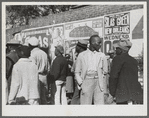 Some of the Negroes watching itinerant salesman selling goods from his truck in the center of town on Saturday afternoon, Belzoni, Mississippi Delta, Mississippi