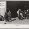 Selling scarves and table covers outside warehouse during tobacco auction, Durham, North Carolina