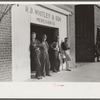 Men standing around outside general store, Wendell, Wake County, North Carolina