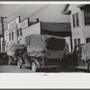 Farmers bringing tobacco to warehouse in trailers, on top of their cars, and even inside their cars for auction. Durham, North Carolina