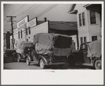 Farmers bringing tobacco to warehouse in trailers, on top of their cars, and even inside their cars for auction. Durham, North Carolina