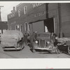 Cars loaded with tobacco going into warehouse to unload for auction sale. Mebane, North Carolina