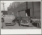 Cars loaded with tobacco going into warehouse to unload for auction sale. Mebane, North Carolina