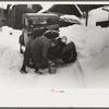 Hired man on farm near Woodstock, Vermont, usually empties the radiator in his car every evening and refills it again with water in the morning to save the cost of antifreeze