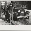 Townspeople of Woodstock, Vermont, discussing the severe winter on the street corner in center of town
