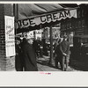 Townspeople of Woodstock, Vermont, discussing the severe winter on the street corner in center of town