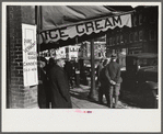 Townspeople of Woodstock, Vermont, discussing the severe winter on the street corner in center of town