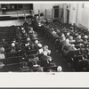 Townspeople listening to discussion and balloting during town meeting. Woodstock, Vermont