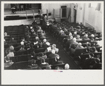 Townspeople listening to discussion and balloting during town meeting. Woodstock, Vermont