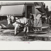 Collecting rubbish with sled in winter. Woodstock, Vermont