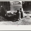Rear view of farmer's car in center of town, Woodstock, Vermont. Water is hauled since the usual supply has been frozen