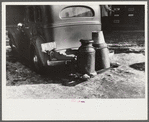Rear view of farmer's car in center of town, Woodstock, Vermont. Water is hauled since the usual supply has been frozen