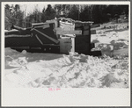 Lumbermen's shack where they can get warm, eat their lunch, and house the tractor with which they haul logs to the road where they are picked up and hauled to the mill by truck. Near Barnard, Windsor County, Vermont