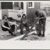 Skiers on porch of Mr. Dickinson's home in Lisbon, Franconia, New Hampshire. He installed a ski tow on his property three years ago costing around one thousand dollars, and this is the first year he has made any money on it,