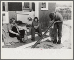 Skiers on porch of Mr. Dickinson's home in Lisbon, Franconia, New Hampshire. He installed a ski tow on his property three years ago costing around one thousand dollars, and this is the first year he has made any money on it,