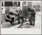 Skiers on porch of Mr. Dickinson's home in Lisbon, Franconia, New Hampshire. He installed a ski tow on his property three years ago costing around one thousand dollars, and this is the first year he has made any money on it,