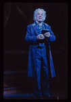 George Rose [full length clutching book] in the stage production The Mystery of Edwin Drood