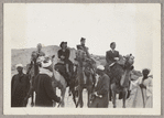 Hubert Carlin, Virginia Lee, Lisan Kay, and Yeichi Nimura riding camels in Egypt