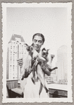 Yeichi Nimura with his cats Wang and Ting on the roof of Carnegie Hall