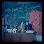 Lisan Kay and Yeichi Nimura with Christmas decorations, likely in their Carnegie Hall studio