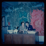 Lisan Kay and Yeichi Nimura with Christmas decorations, likely in their Carnegie Hall studio
