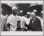 Melville J. Herskovits and Nigerian Prime Minister Abubakar Tafawa Balewa posed holding a stack of books at Northwestern University