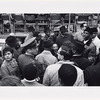 Surrounded by supporters, advisors, and security personnel, Dr. King prepares for his speech at the United Nations on April 15, 1967. At left is NBC correspondent Ponchita Pierce