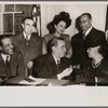 Photograph of Mayor William O' Dwyer receiving three Booker T. Washington Half Dollars at City Hall with accompanying note