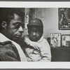 Baldwin holding child, Louisiana, 1963