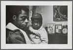 Baldwin holding child, Louisiana, 1963