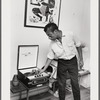 Baldwin turning knob on record player, 1963