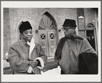 Baldwin, left, with brother David in front of church