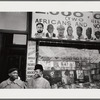 Baldwin with nephew in front of African National Memorial Bookstore