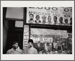 Baldwin with nephew in front of African National Memorial Bookstore