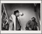 Baldwin, left, with brother David in stairwell