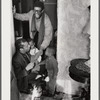 Baldwin, lower left, in doorway with brother David and two small children