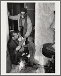 Baldwin, lower left, in doorway with brother David and two small children